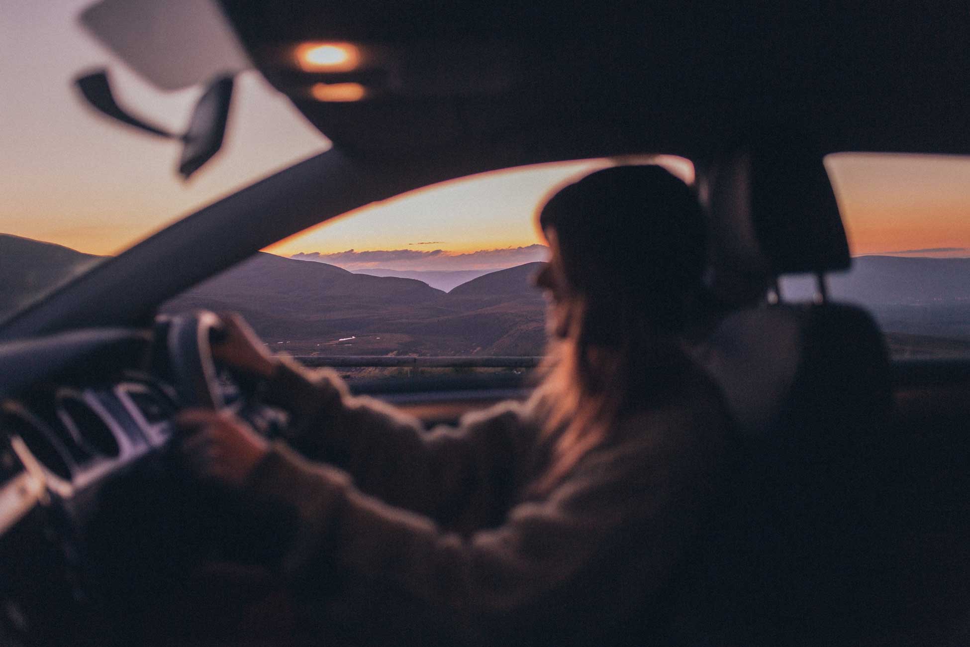 A lady driving a car