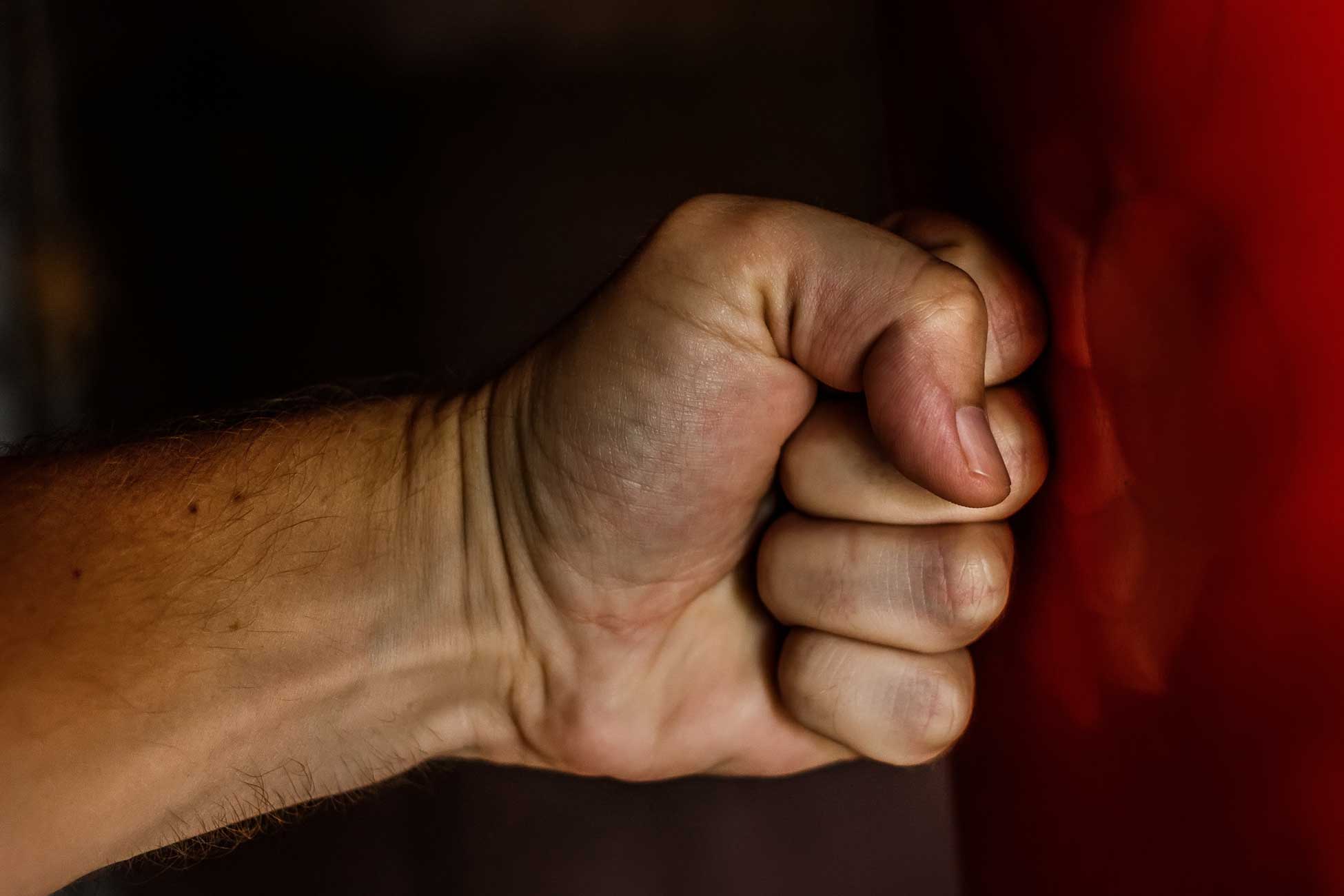 a closed fist punching